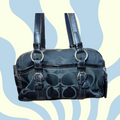 Coach handbag with signature logo on a blue and yellow abstract background