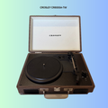 Crosley CR800portable record player on a gradient background