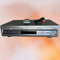 Sony Hi-Fi stereo system with remote control and cable on a gradient background