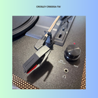 Close-up of a Crosley CR8005A-TW turntable's power knob and needle lever.