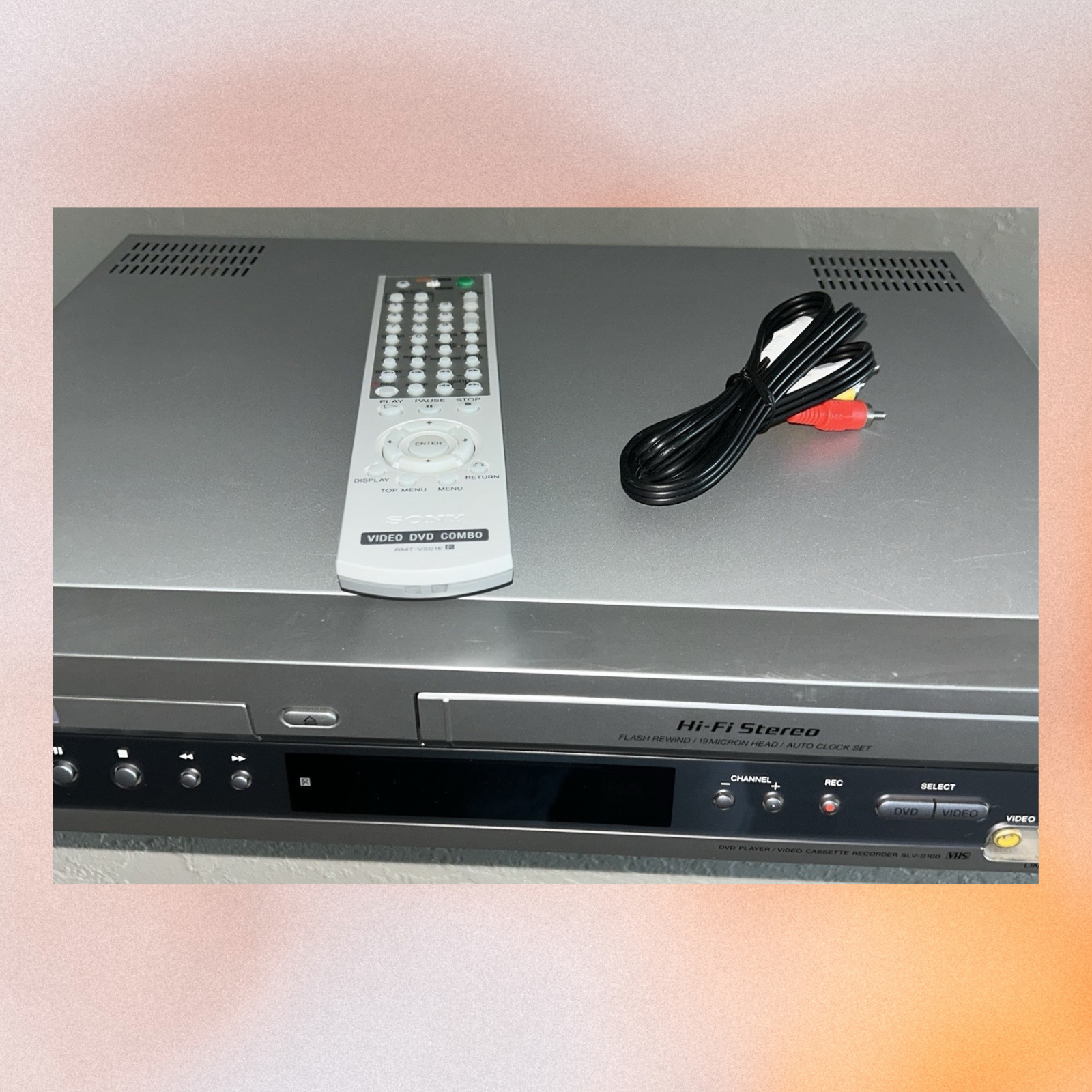 Sony Hi-Fi stereo system with remote control and cables on a light gray background