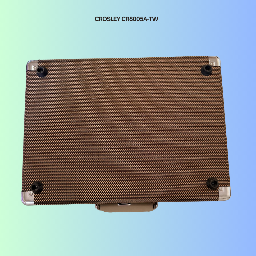 Bottom of a Crosley CR8005A-TW portable turntable. Shows rubber feet to prevent turntable from gliding.