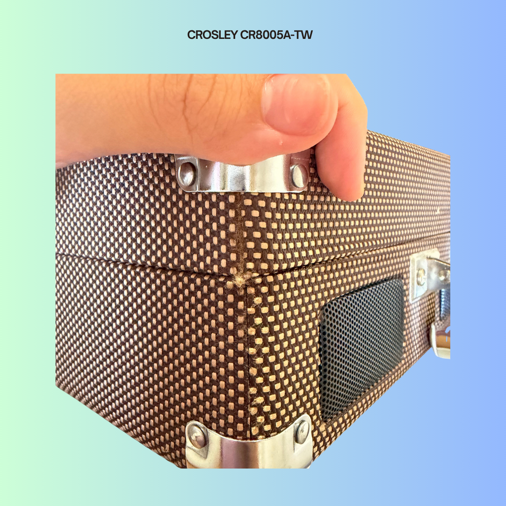 Crosley CR8005A-TW showing minor cosmetic flaw of thread from turntable is poking out from the side of the turntable.