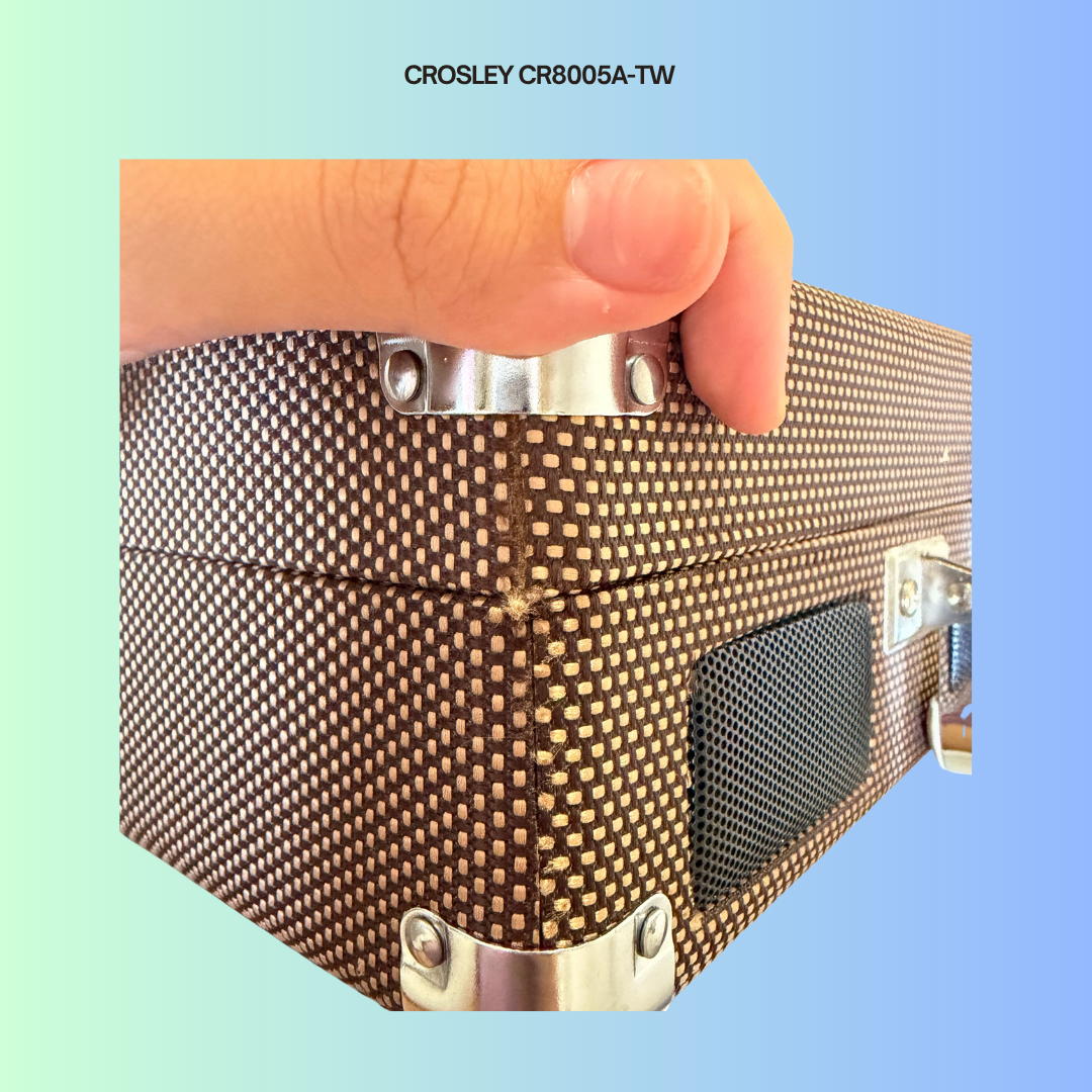 Crosley CR8005A-TW showing minor cosmetic flaw of thread from turntable is poking out from the side of the turntable.